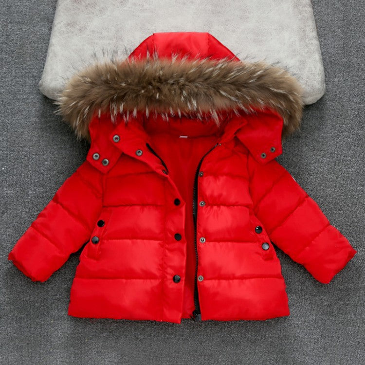 Girls Red puffer jacket with fur hood on a gray surface