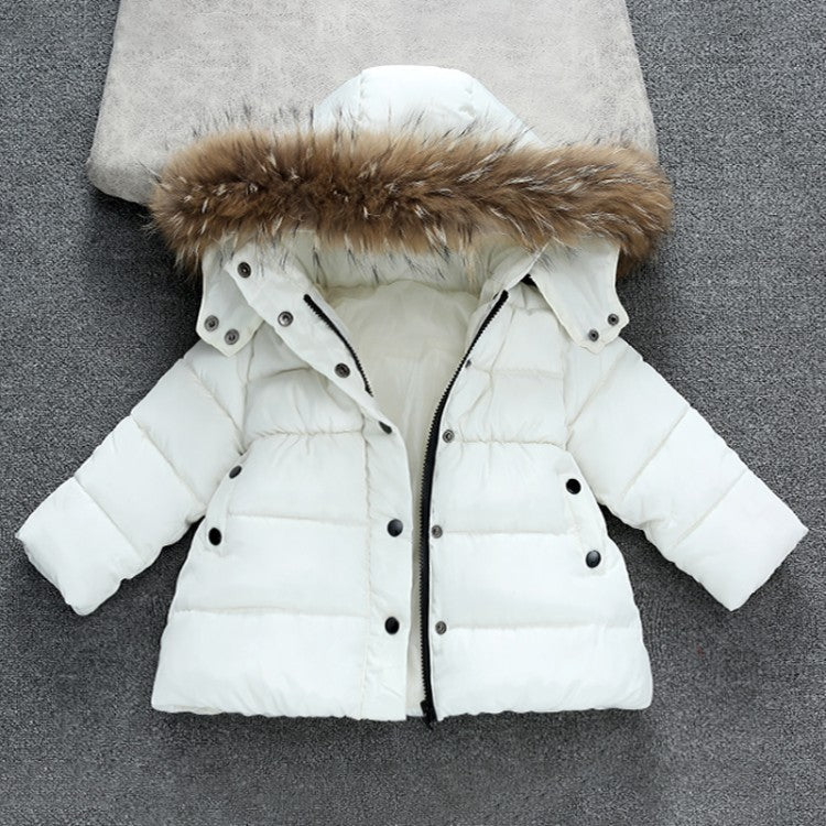 A girls' winter down jacket with a hood, primarily white with black details and a fur lining at the hood.