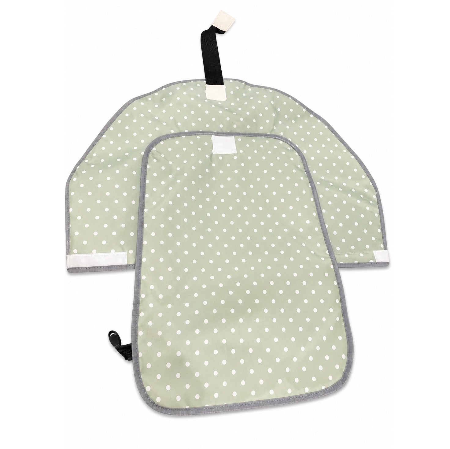Green diaper changing mat with white polka dots and gray trim on a white background