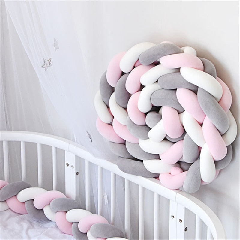 White-gray-pink knotted braided baby bed bumper The Toddly