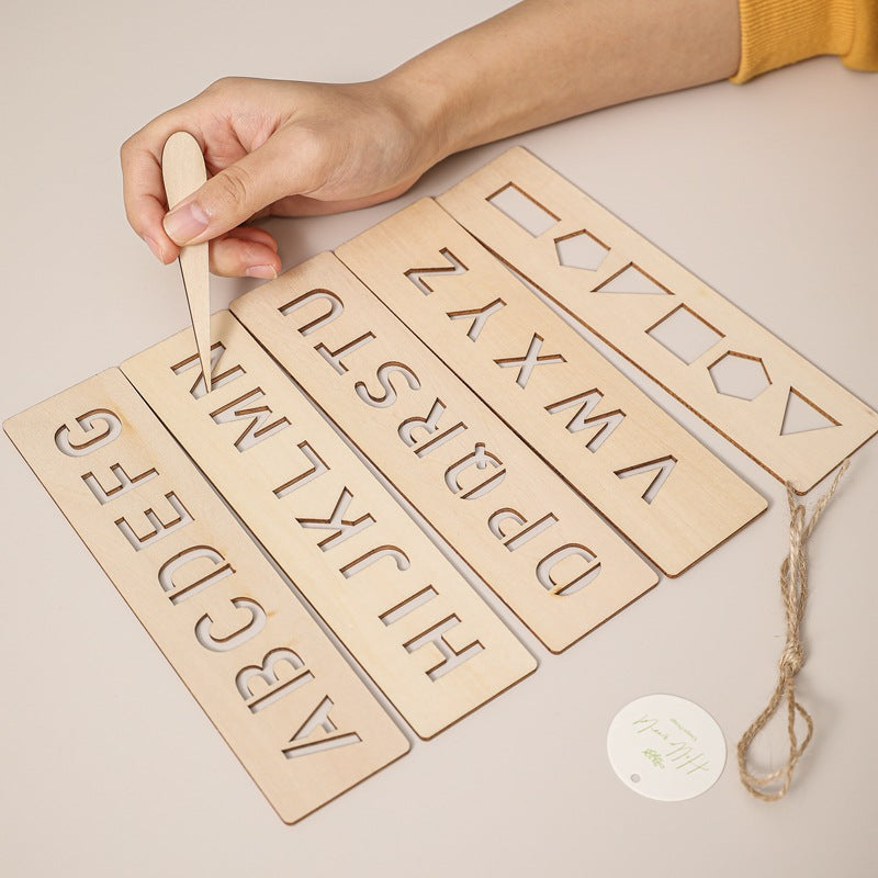 Girl practicing writing on tracing board for kids