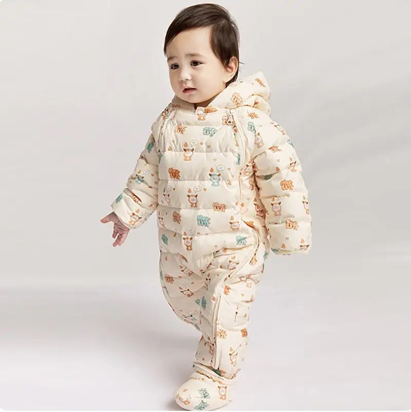 baby boy wearing beige hooded snowsuit thetoddly