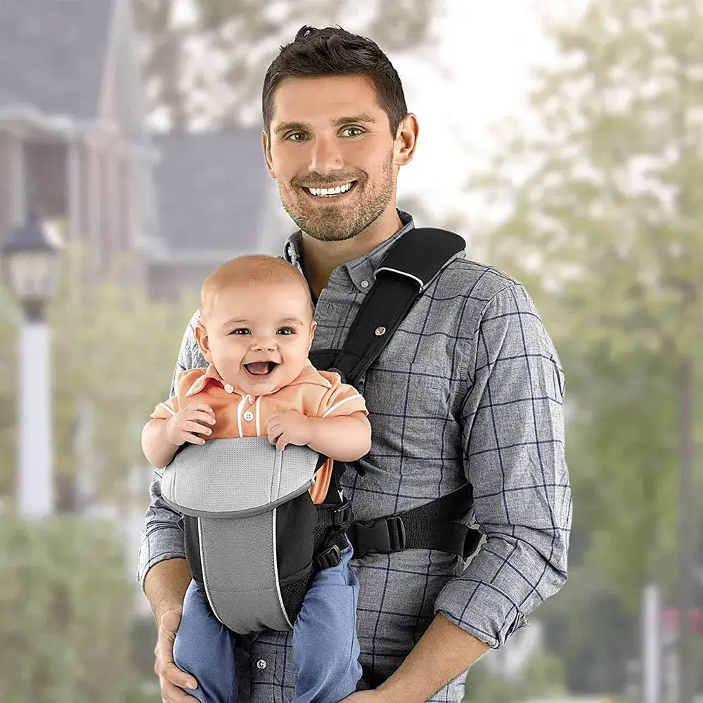 dad carrying the baby in a baby carrier backpack