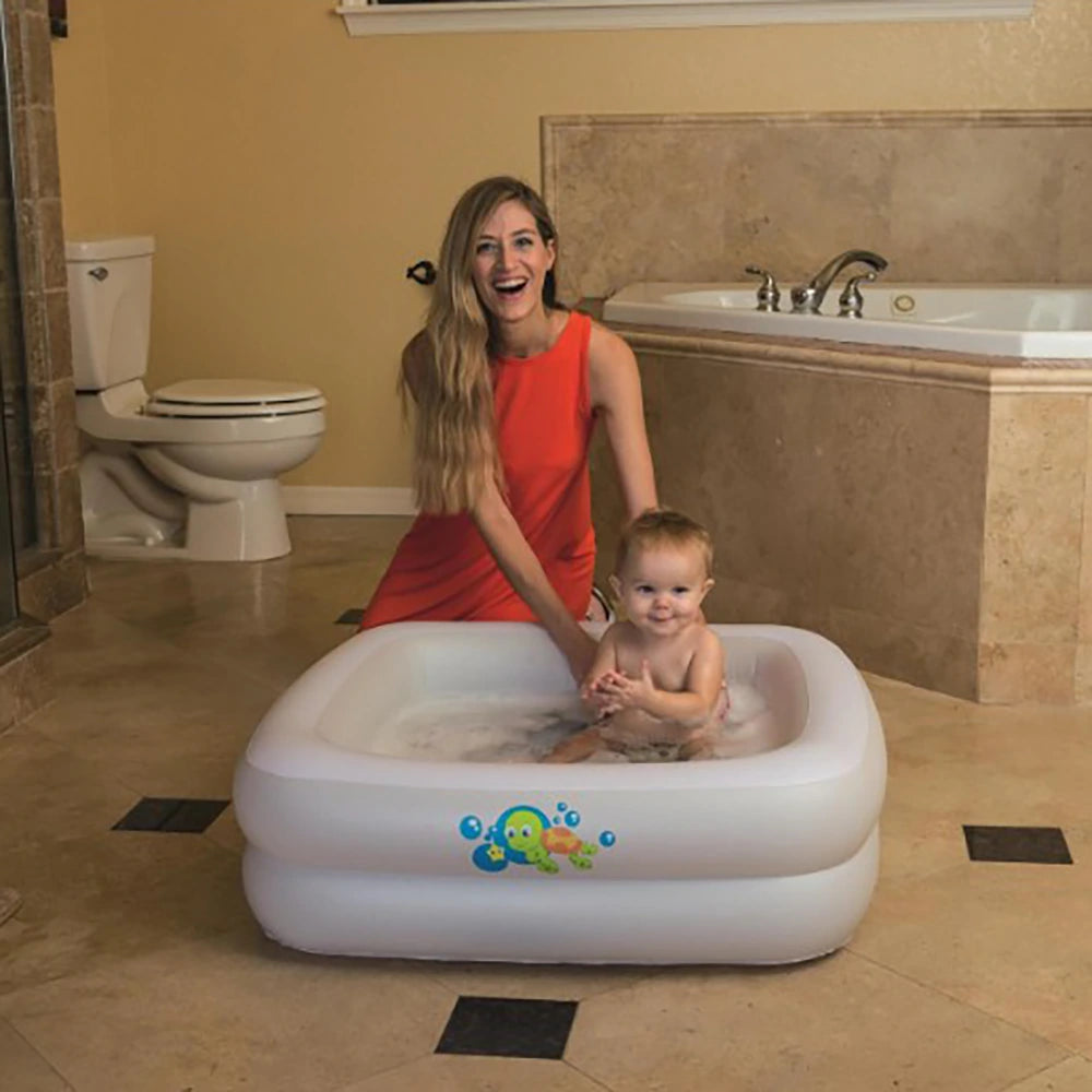 mom baby in a square white inflatable baby paddling pool bath tub